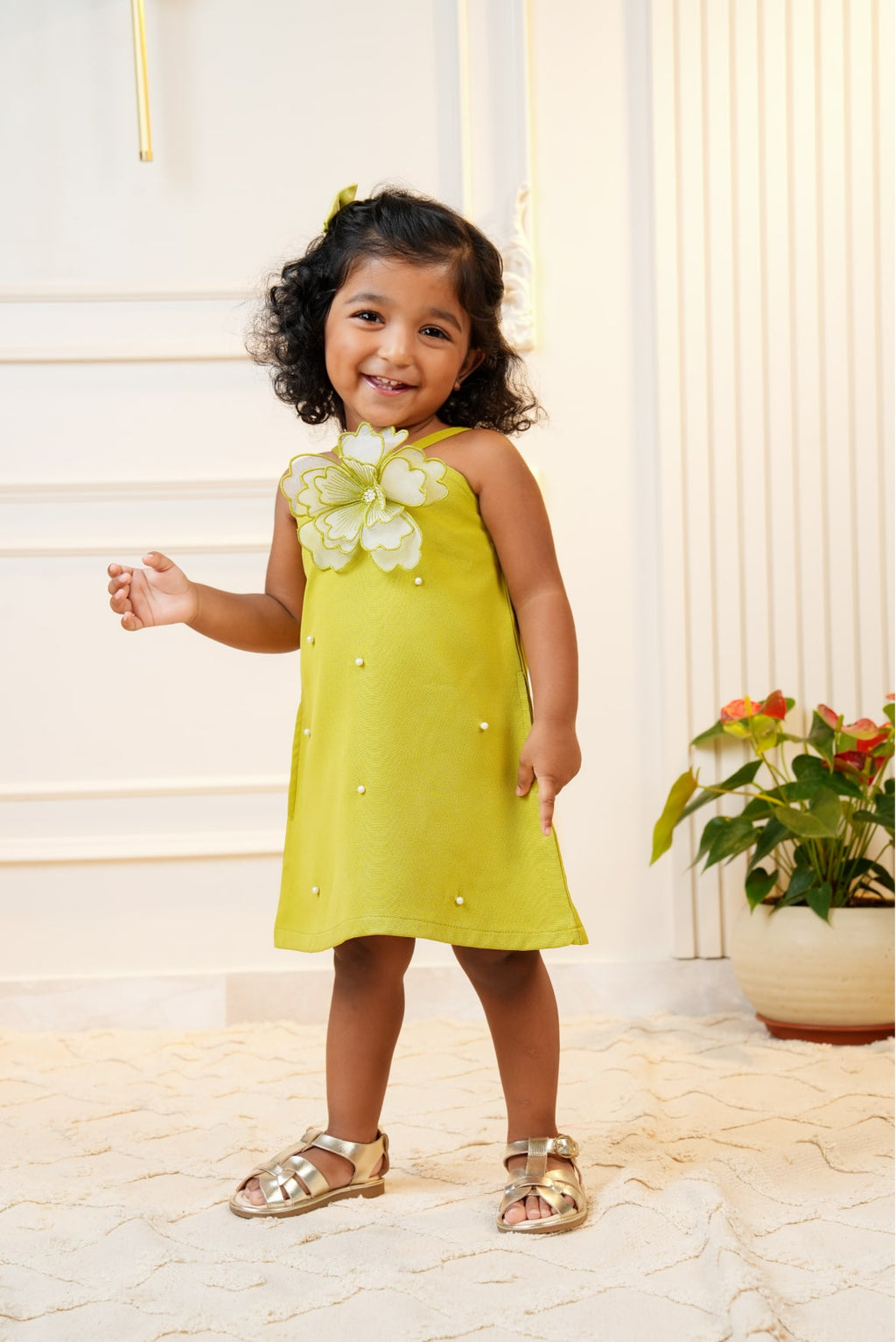 Green strap dress with embroidered flower