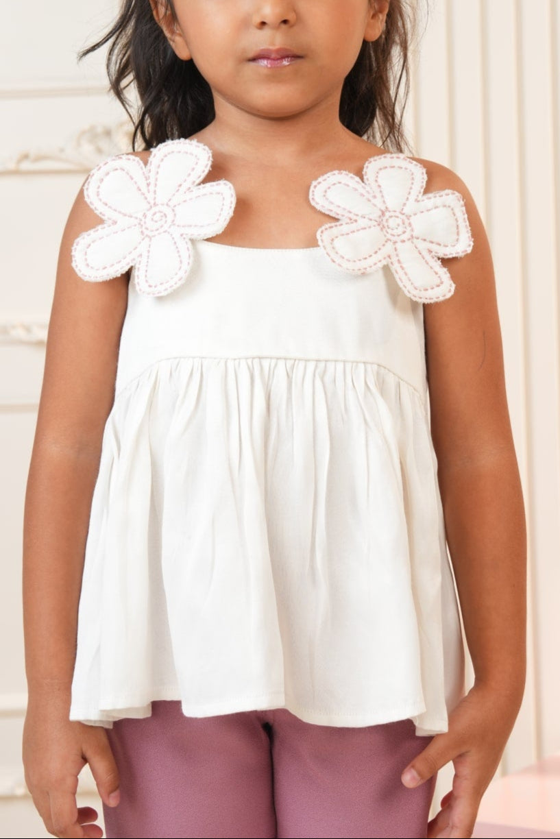 White strap top with pink flared pants