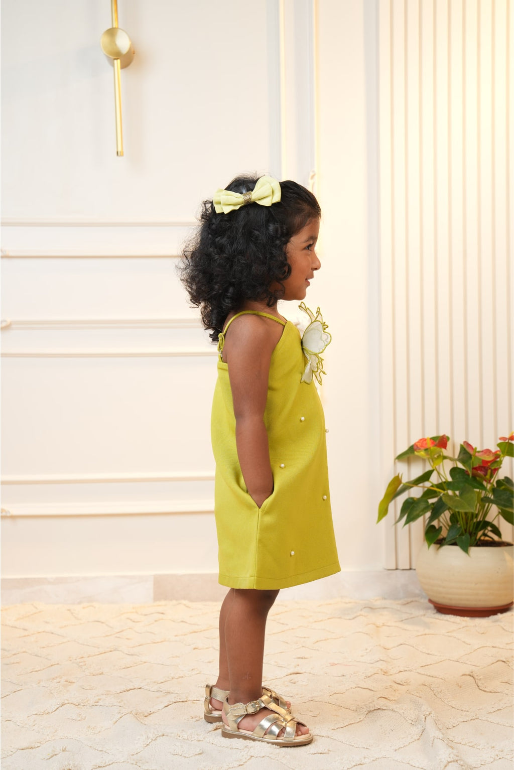 Green strap dress with embroidered flower