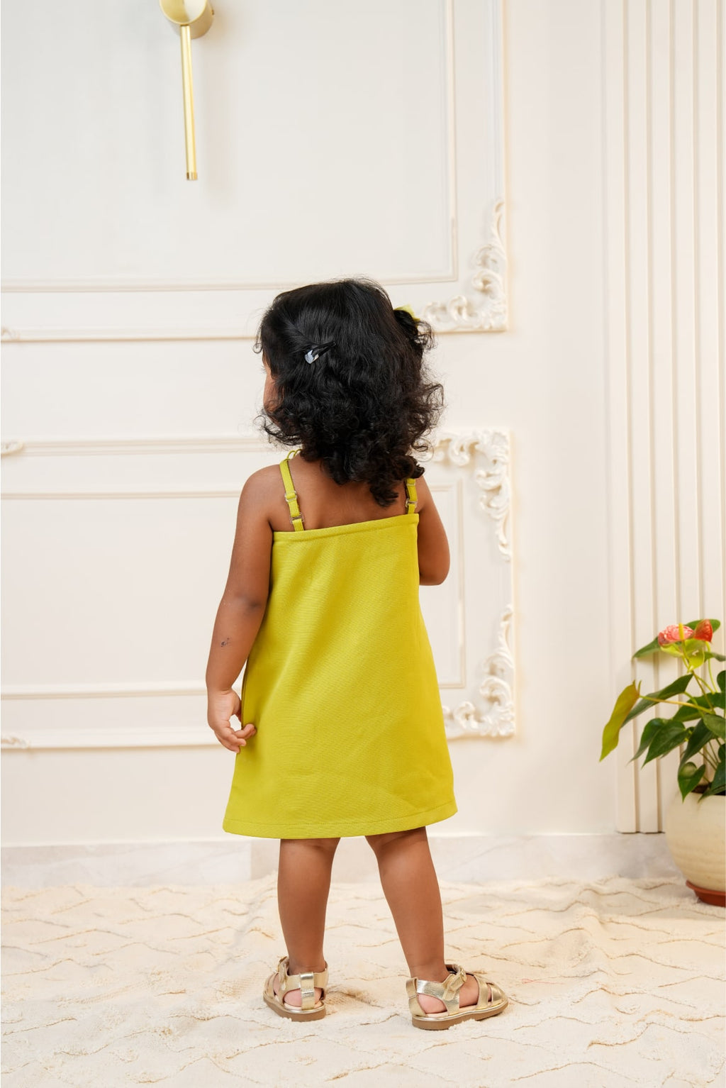 Green strap dress with embroidered flower